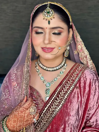 A close-up of the makeup, showing the shimmery eyeshadow and the soft pink lip.