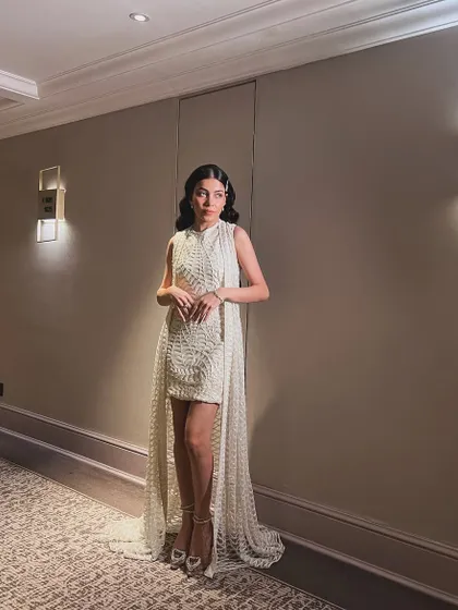 A full-length view of a glamorous evening look. I styled the hair in classic Hollywood waves, parted to the side and accessorized with a simple clip for a touch of sparkle.