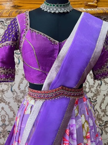 A closer view of the lavender half saree, highlighting the detailed embroidery on the blouse and the delicate fabric of the organza dupatta.