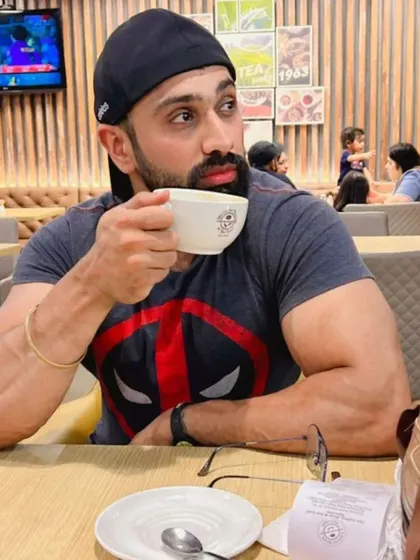 Enjoying a cup of coffee. Even in casual moments, the results of a disciplined lifestyle are visible. It's about being better than you were yesterday.