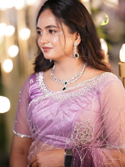 A client looking elegant in a modern diamond-look necklace with black stones. It's a chic and sophisticated choice for an evening party or reception.