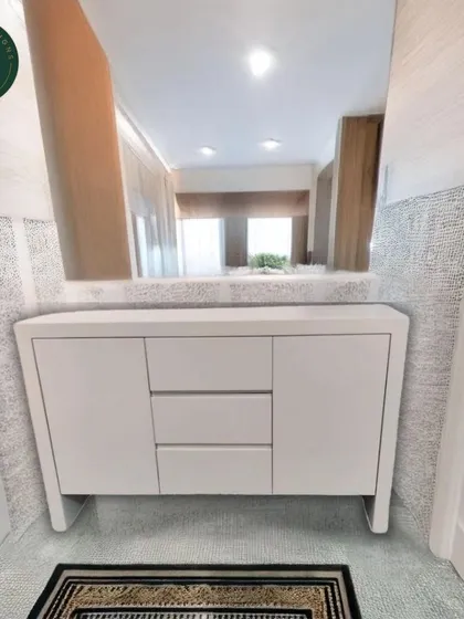 The same white sideboard installed in a client's hallway, demonstrating its clean, functional design in a real-world setting.