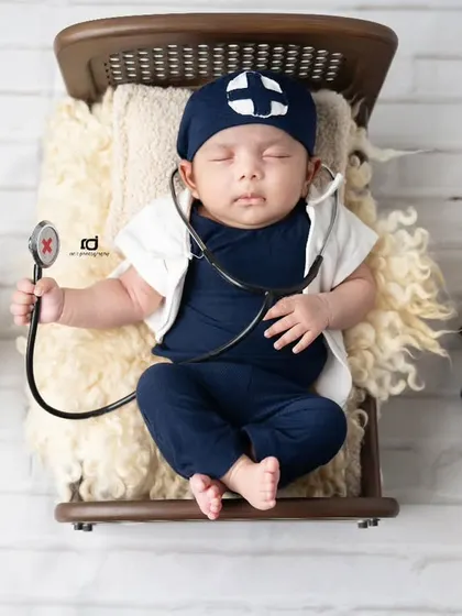 This tiny doctor is checking his own heartbeat. A fun and creative theme for a future lifesaver.