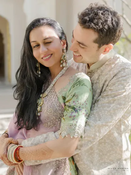 A warm, sunny embrace. The beautiful light and genuine smiles make this a perfect portrait of love and happiness.