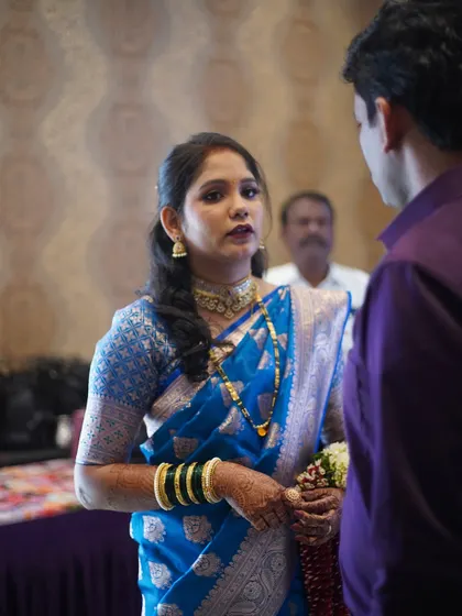 A candid conversation. The bride's makeup looks beautiful and natural even in unposed, in-between moments.
