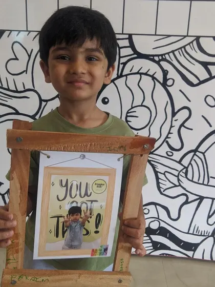 A beautiful, handcrafted wooden photo frame, complete with a picture from the workshop itself. A perfect memento of a fun day of learning and creating.