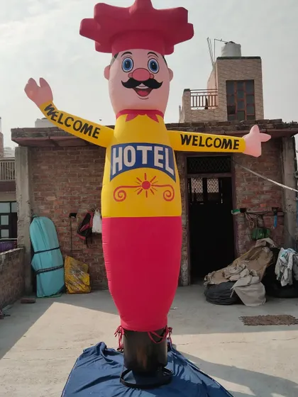 A classic hotel welcome air dancer. The bright yellow and red colors are chosen to be highly visible, and the welcoming gesture of the character is very effective.