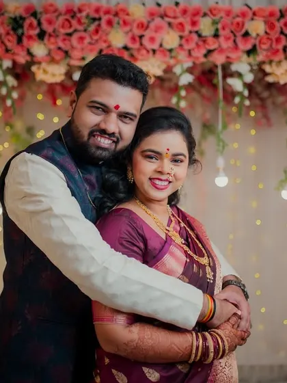 A joyful hug from the groom makes the bride light up with happiness. This candid shot perfectly captures the celebratory and loving atmosphere of their engagement.