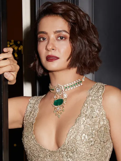 Another powerful portrait of Surveen Chawla, her gaze direct and confident, her jewelry a testament to her style.