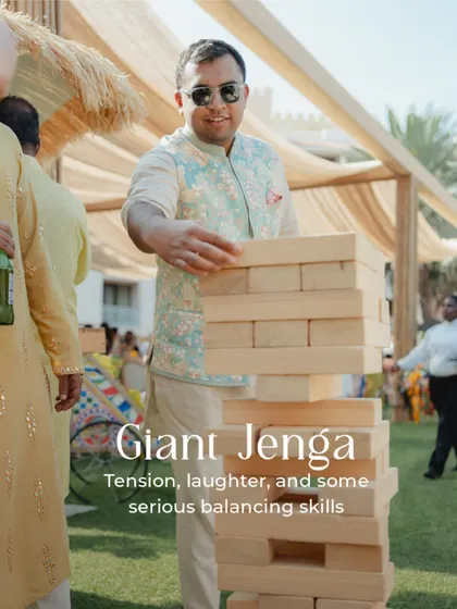 Giant Jenga is always a hit. It brings out laughter, a bit of friendly competition, and some serious balancing skills, making it a great icebreaker for guests.