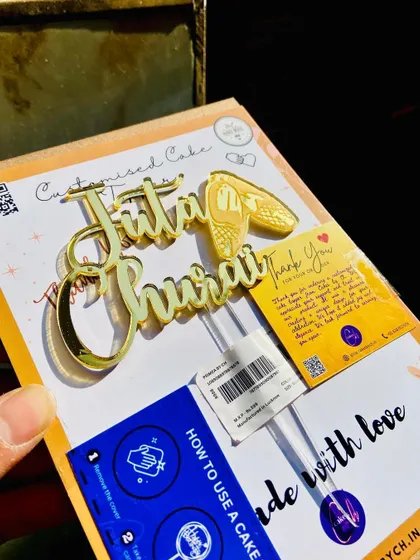 The "Juta Churai" topper in its packaging, complete with instructions, ready for the fun and games of a wedding.