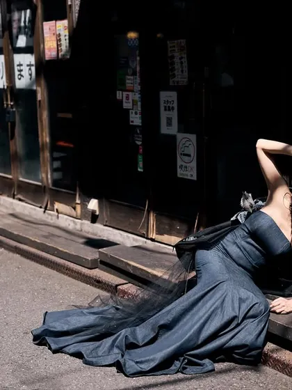 Using the harsh midday sun to our advantage in a Tokyo alley. The deep shadows create a dramatic, high-contrast scene, carving the model out from the background. This is how you make natural light work for you.