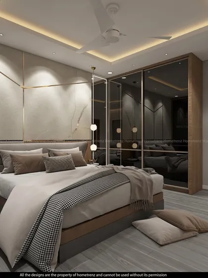 I designed this master bedroom with a striking wall treatment using marble-finish panels and gold-tone metal inlays. The wardrobe features smoked glass doors, and pendant lights hang आधुनिकly over the floating nightstands.