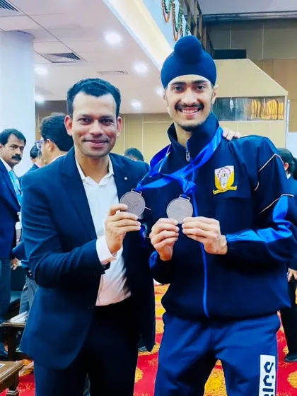 Another moment with my coach, celebrating two medals. His belief in me is a powerful motivator.