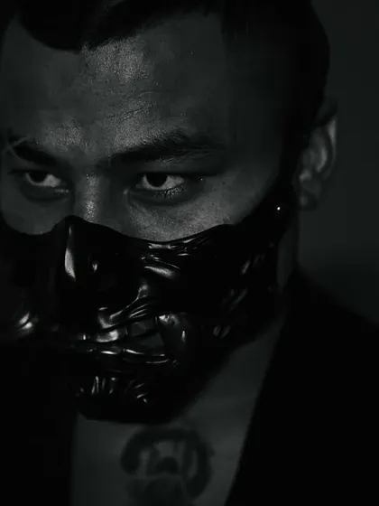 The intense gaze of a champion, masked and ready for battle.