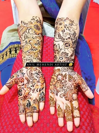 A beautiful floral design that covers the hands and forearms. The use of shading gives the flowers a soft, delicate look.