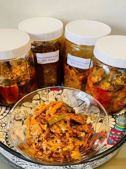 This is my Panchmela Achaar, a classic mixed vegetable pickle. It packs a real punch with a mix of seasonal vegetables like carrots, cauliflower, and turnips, all pickled in a tangy and spicy masala.