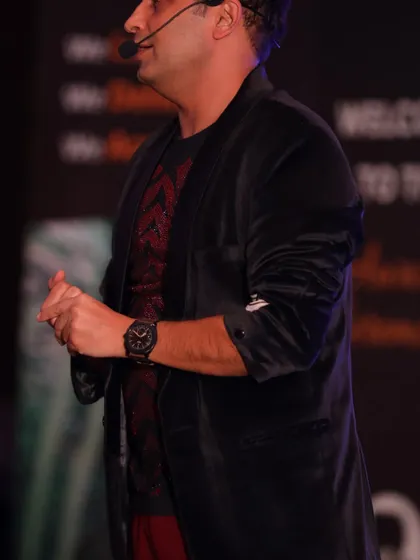 A close-up shot during my performance at the Balrampur Chini Mills event. I focus on creating a personal connection with the audience, even in a large hall.