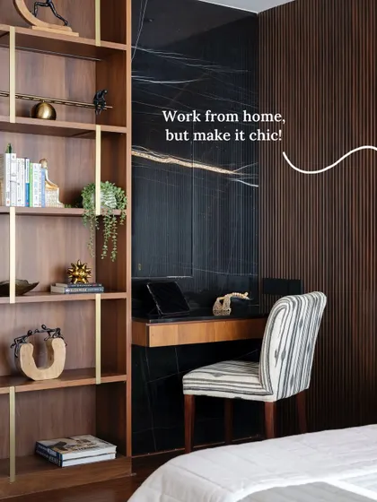 A close-up of the chic and functional workspace with a black marble backdrop and fluted wood paneling, showing how to make work from home stylish.