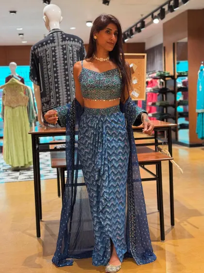 Here I am trying on a modern ethnic co-ord set. I love showing my clients how to play with contemporary silhouettes, like these draped pants and crop top, to keep their traditional wear feeling fresh and trendy.