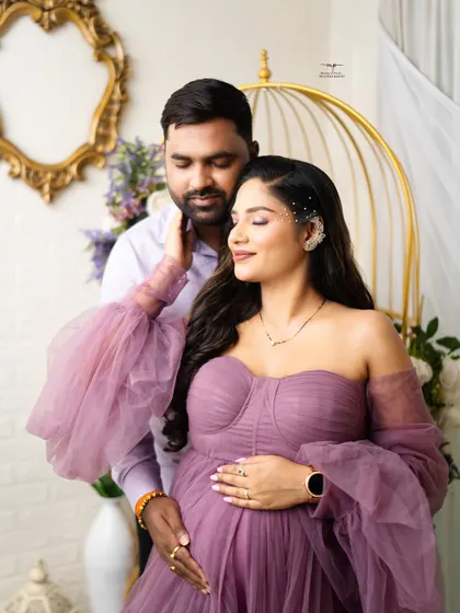 A close-up portrait showcasing the serene expression of the mother-to-be as her partner gently holds her. It’s these quiet moments that I love to capture.