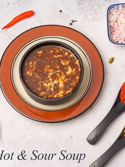 A popular Indo-Chinese soup, our Hot & Sour is packed with shredded vegetables and chicken in a spicy and tangy broth, thickened to a satisfying consistency.