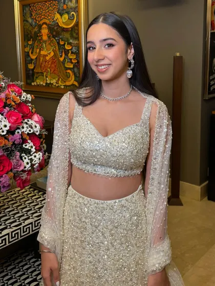 Another angle of this stunning party glam look. The sleek hair and glowing skin are perfect for a cocktail event.