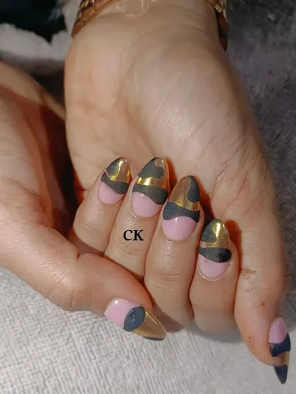 Another look at the pink, black, and gold chrome abstract design.