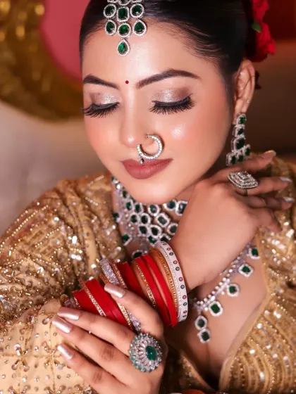 A beautiful shot showing the intricate details of the bridal look, from the choora to the eye makeup.
