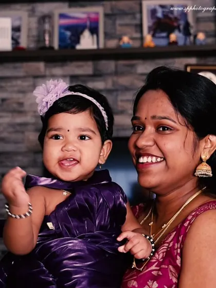 The bond between a mother and child is undeniable. This candid shot captures a happy, natural interaction, resulting in a portrait that feels authentic and full of love.