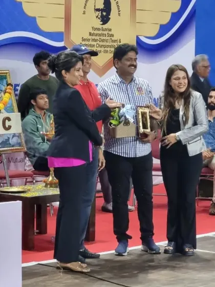 Our directors presenting a token of appreciation to an official at the state-level tournament.
