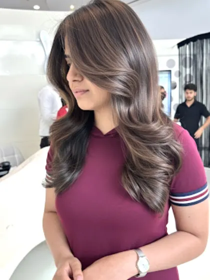 A beautiful rich brown with cappuccino tones. For this look, I focused on adding volume and dimension with a layered cut and soft styling to create a glamorous finish.