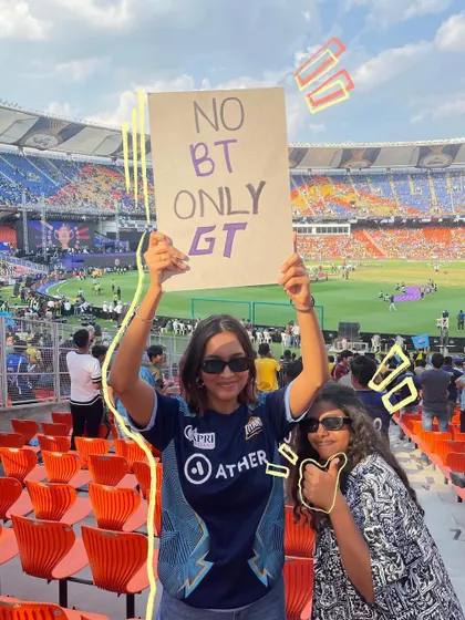 Holding up my sign for Gujarat Titans in the stadium.