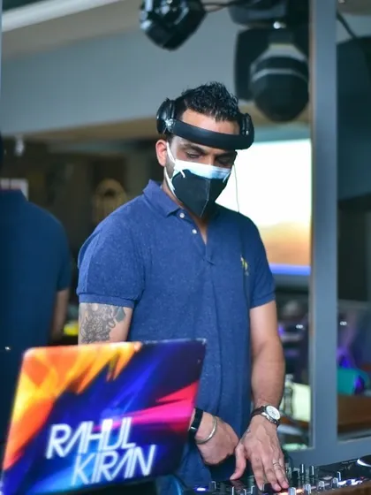 A shot of me DJing while masked up during the pandemic. The music never stops, and I adapted to ensure events could still happen safely.