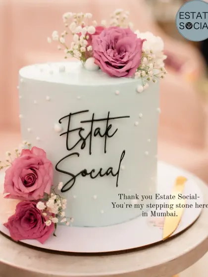 A beautiful pastel blue cake created for an "Estate Social" event, decorated with fresh pink roses and baby's breath.