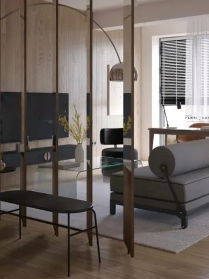 A unique living room layout featuring a curved room divider and a modern grey daybed. The design plays with shapes and textures to create a dynamic and interesting space.