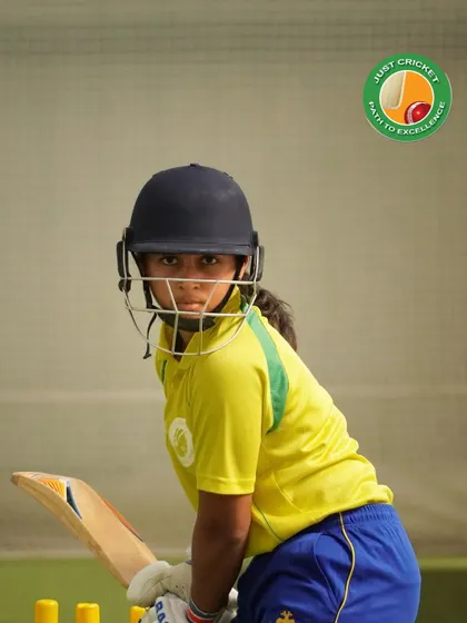 The eye of the tiger. A young female batter shows laser-sharp focus as she prepares to face a delivery in the nets.