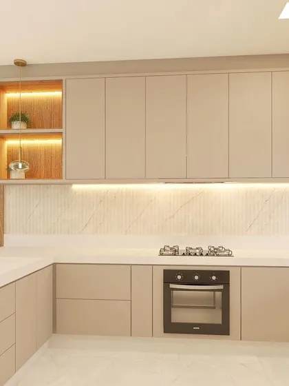 This view highlights the clean lines of the beige kitchen, with handleless cabinets, a built-in hob, and open shelving with accent lighting.