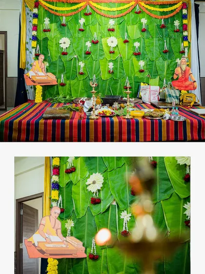 The beautifully decorated stage for an Upanayanam, featuring a backdrop of banana leaves and traditional motifs. We document the decor that sets the scene.