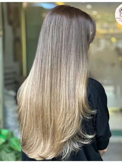 This shot captures the soft, layered ends and the beautiful gradient of the balayage. It's a truly dreamy hair color.