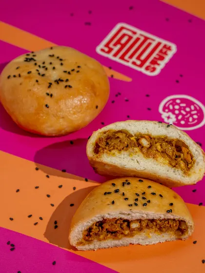 Due to popular demand, we brought back our Chicken Buns. A generous, spiced chicken filling is encased in a soft bread. It’s a snack that feels like a warm hug.