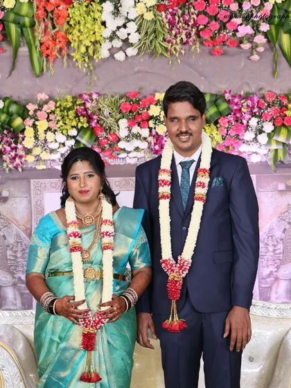 A formal portrait of the couple on their reception stage. We ensure the lighting and composition are perfect for these essential family keepsakes.