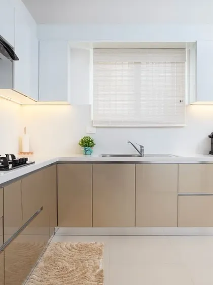 This angle highlights the ample counter space and the natural light coming from the window. A well-lit kitchen is a joy to cook in, and this space is designed to be bright and airy.