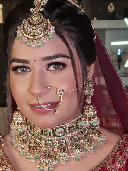 A close-up that captures the beautiful details of her makeup and jewelry.