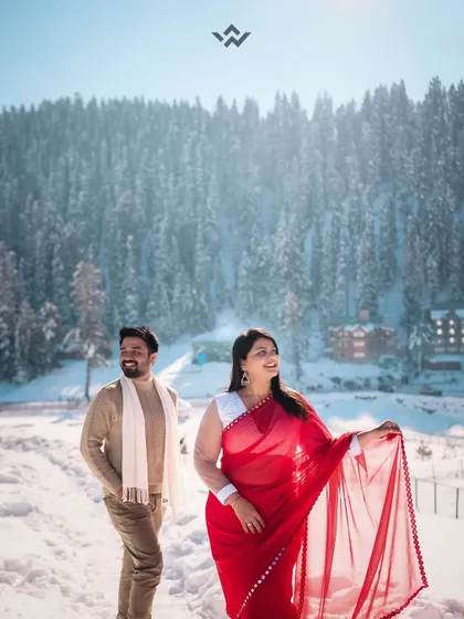 A romantic shot of the couple walking through the snow. A destination pre-wedding shoot like this is an adventure in itself, and we are there to capture every magical moment.