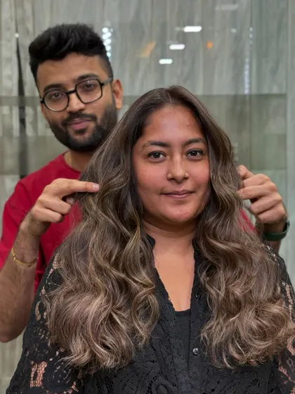 Our stylist with a happy client, showcasing her new cool-toned color. We believe in cool tones, warm hearts, and hot looks.