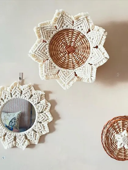 This set includes a macrame-framed mirror and matching wall decor. The floral-inspired macrame border adds a beautiful, handcrafted touch to a functional mirror.
