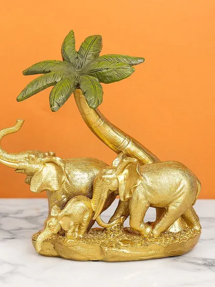 A heartwarming scene of an elephant family under a palm tree, all finished in a lovely antique gold. This showpiece symbolizes family, protection, and strength.