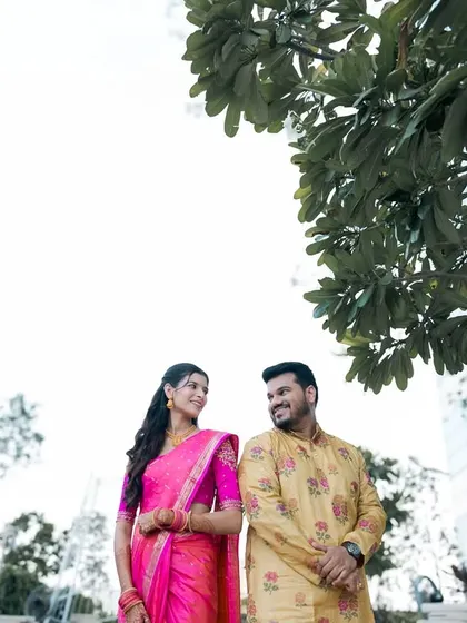 A low-angle shot of a couple during their pre-wedding shoot.