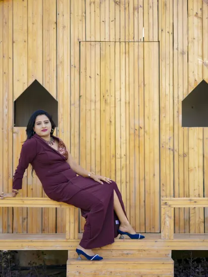 A relaxed and elegant pose in the wooden cabin, perfect for a personal or birthday photoshoot.